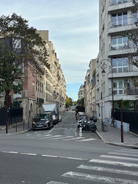 walking through Neuilly-sur-Seine, Paris neighborhood with motorbikes parked in